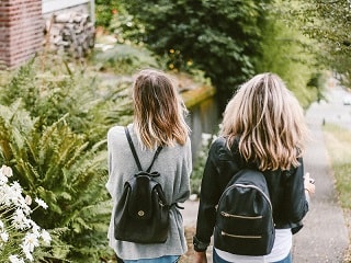 photo of students walking down street